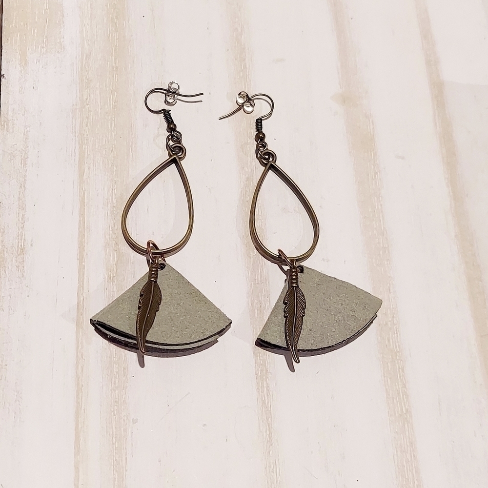 Gray suede earrings with metal feather pendants